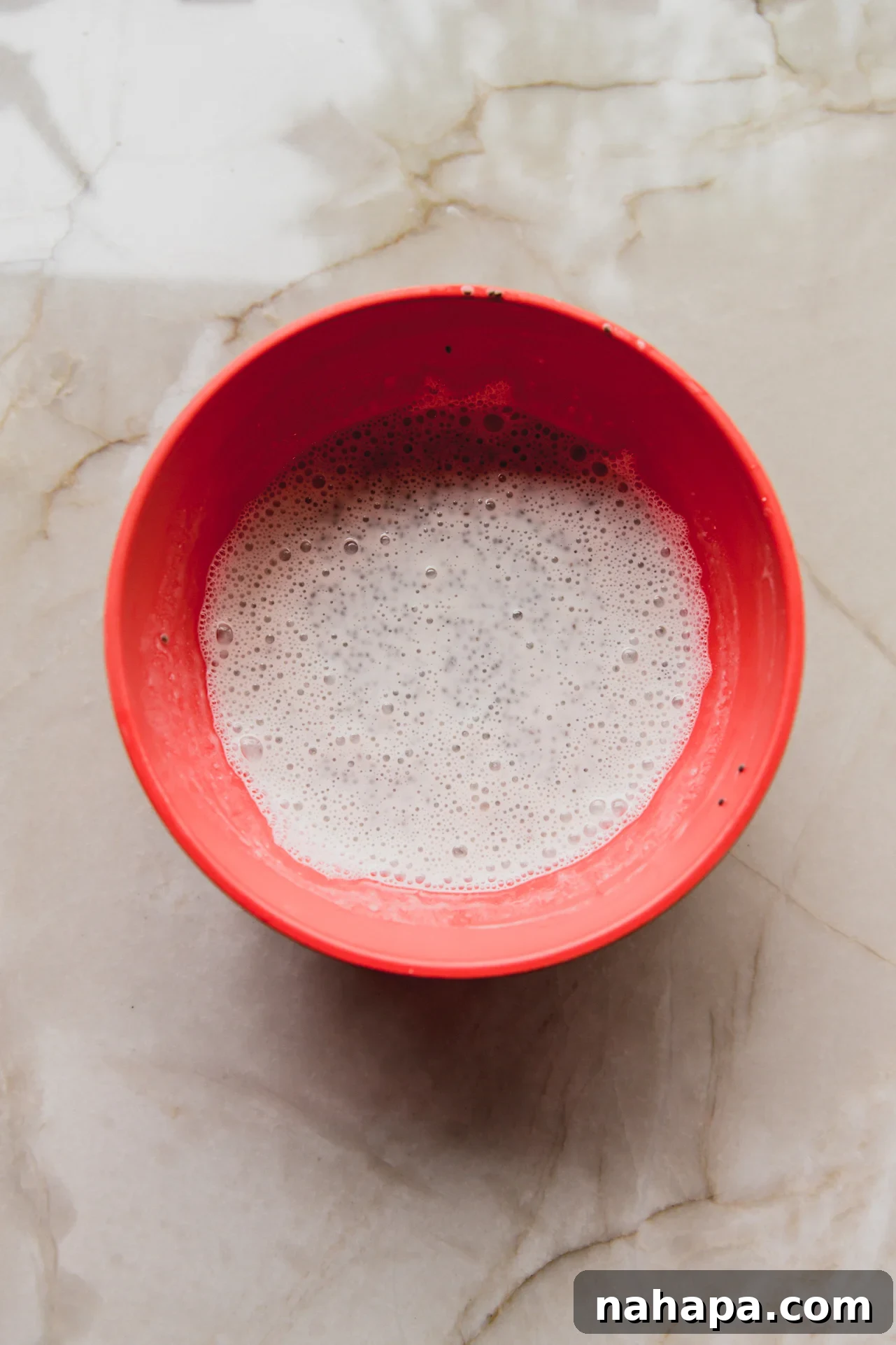 The chia seed mixture after thorough mixing, appearing smooth and homogenous.
