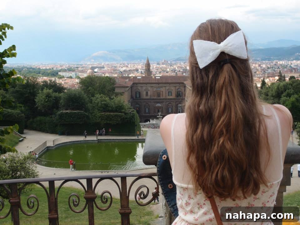 Michelle overlooking Florence, symbolizing the achievement of health and travel dreams through perseverance.