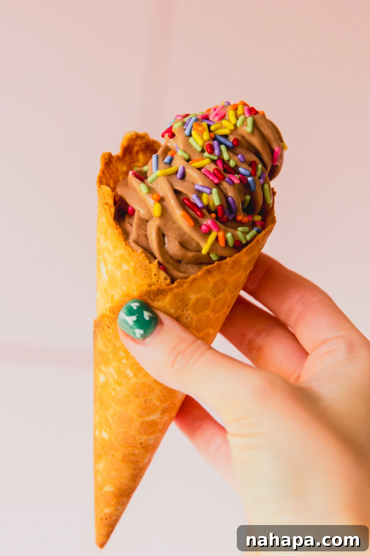 Chocolate protein ice cream in a cone.