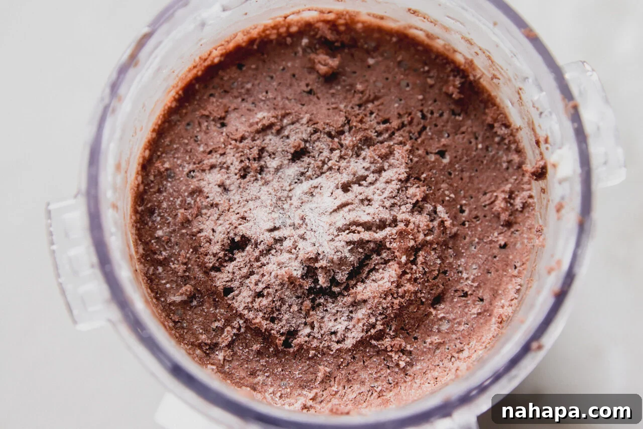 Chocolate protein ice cream frozen in a ninja creami container. 