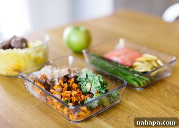 Cultivating Digestive Health The Natural Way 3 A table with two containers of meal prep and an apple on it.