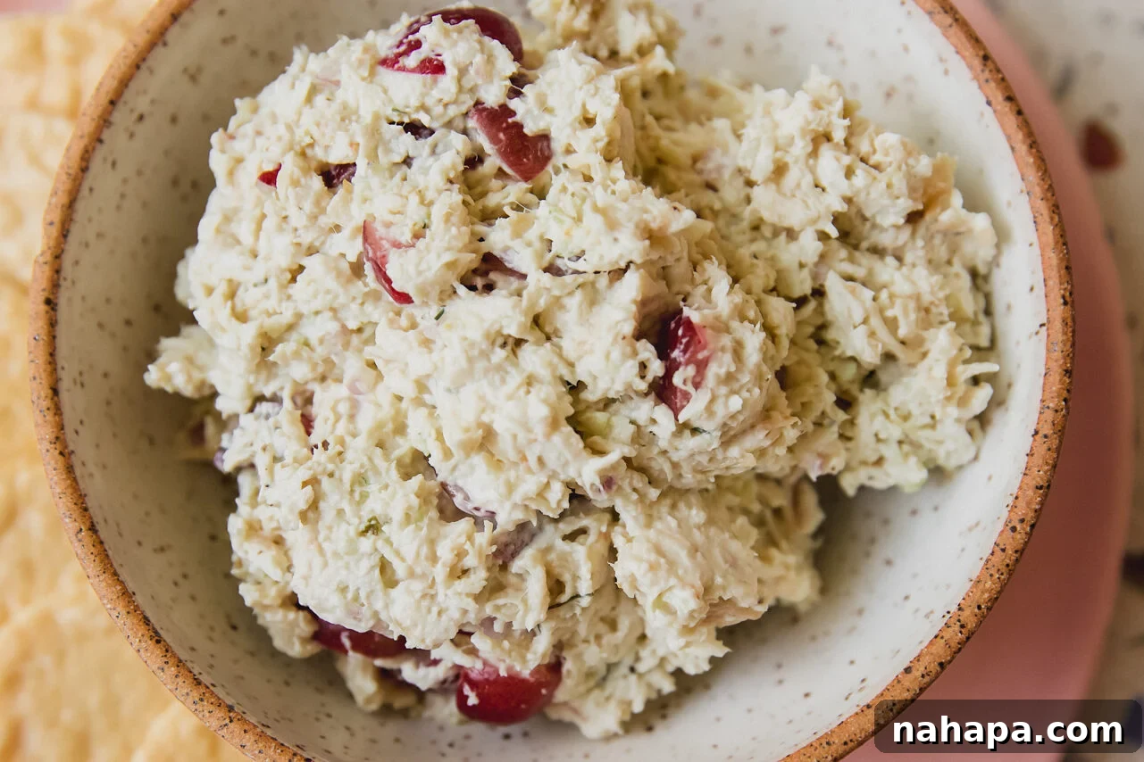 The finished chicken salad in a serving bowl, perfectly mixed and chilled.