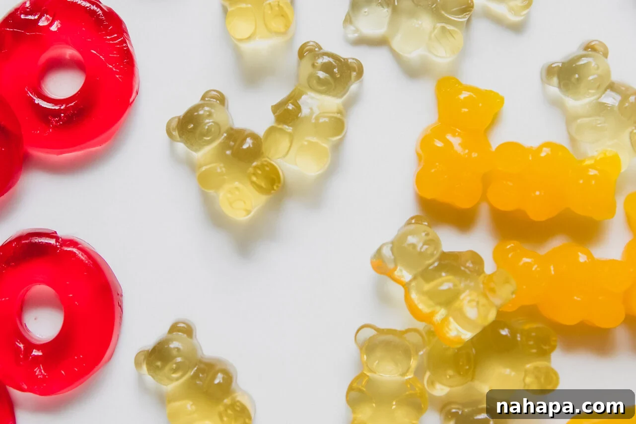Assorted gummy rings and gummy bears arranged on a plate, ready to be used as fun pool cake decorations.