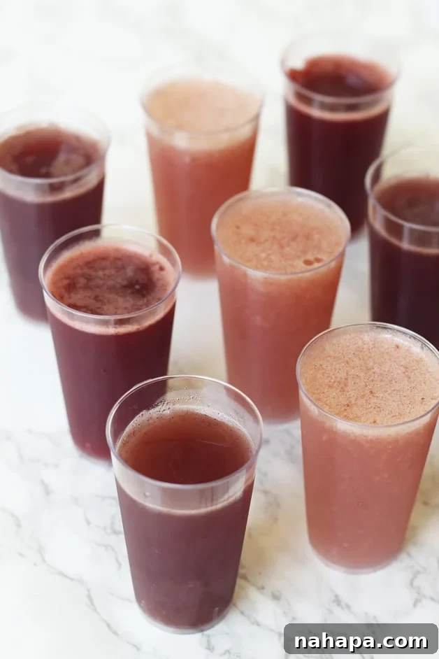 Probiotic Party Bites 2 8 glasses of kombucha jello shots standing in rows on a counter.