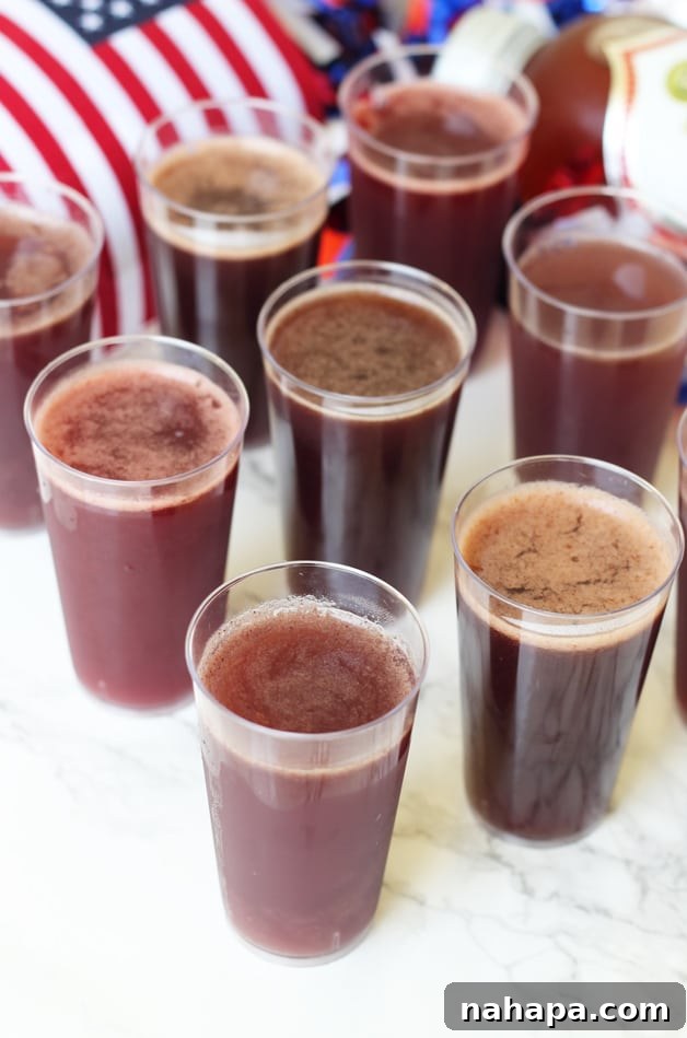 Probiotic Party Bites 3 8 glasses of kombucha jello shots standing in rows on a counter.