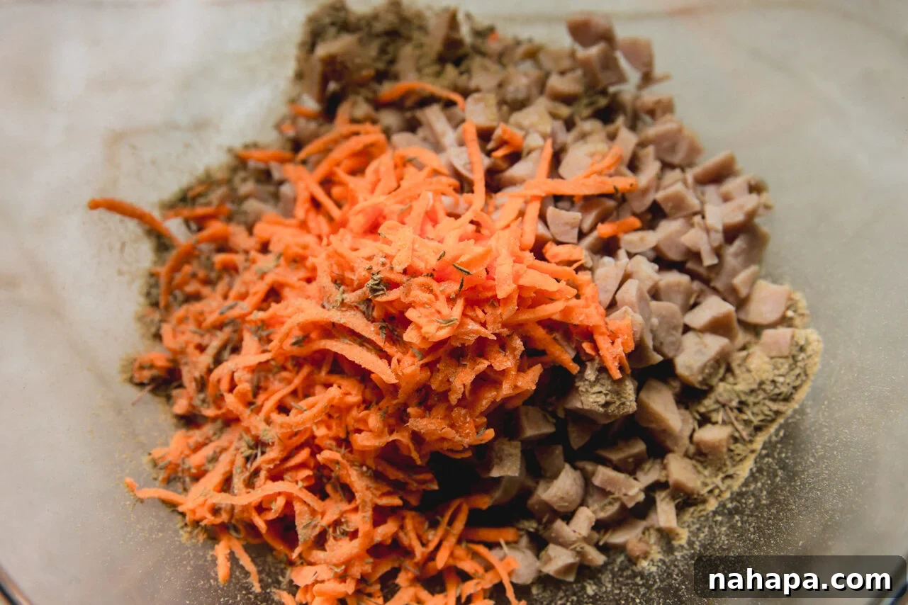 Energizing Protein Breakfast Bites 5 The sausage and shredded sweet potato in a bowl before mixing.