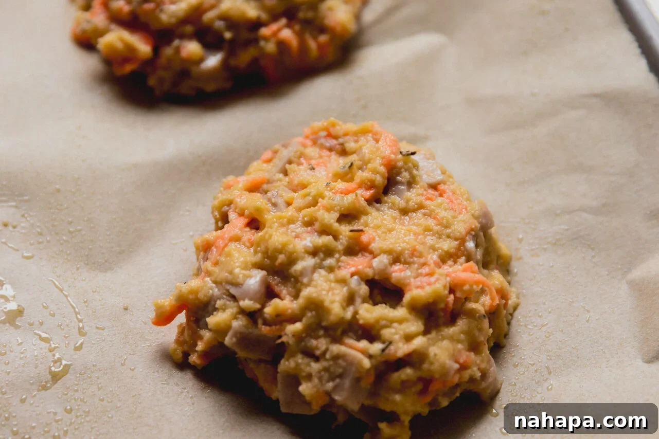 Energizing Protein Breakfast Bites 7 The dough for protein breakfast biscuits scooped out on a baking sheet.