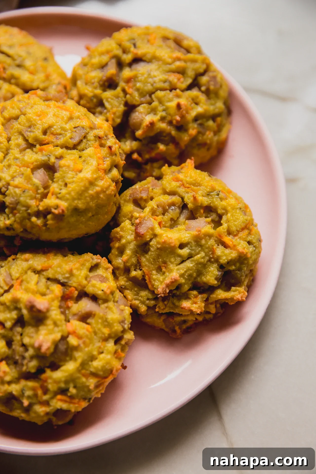 Energizing Protein Breakfast Bites 9 Protein breakfast biscuits on a pink plate.