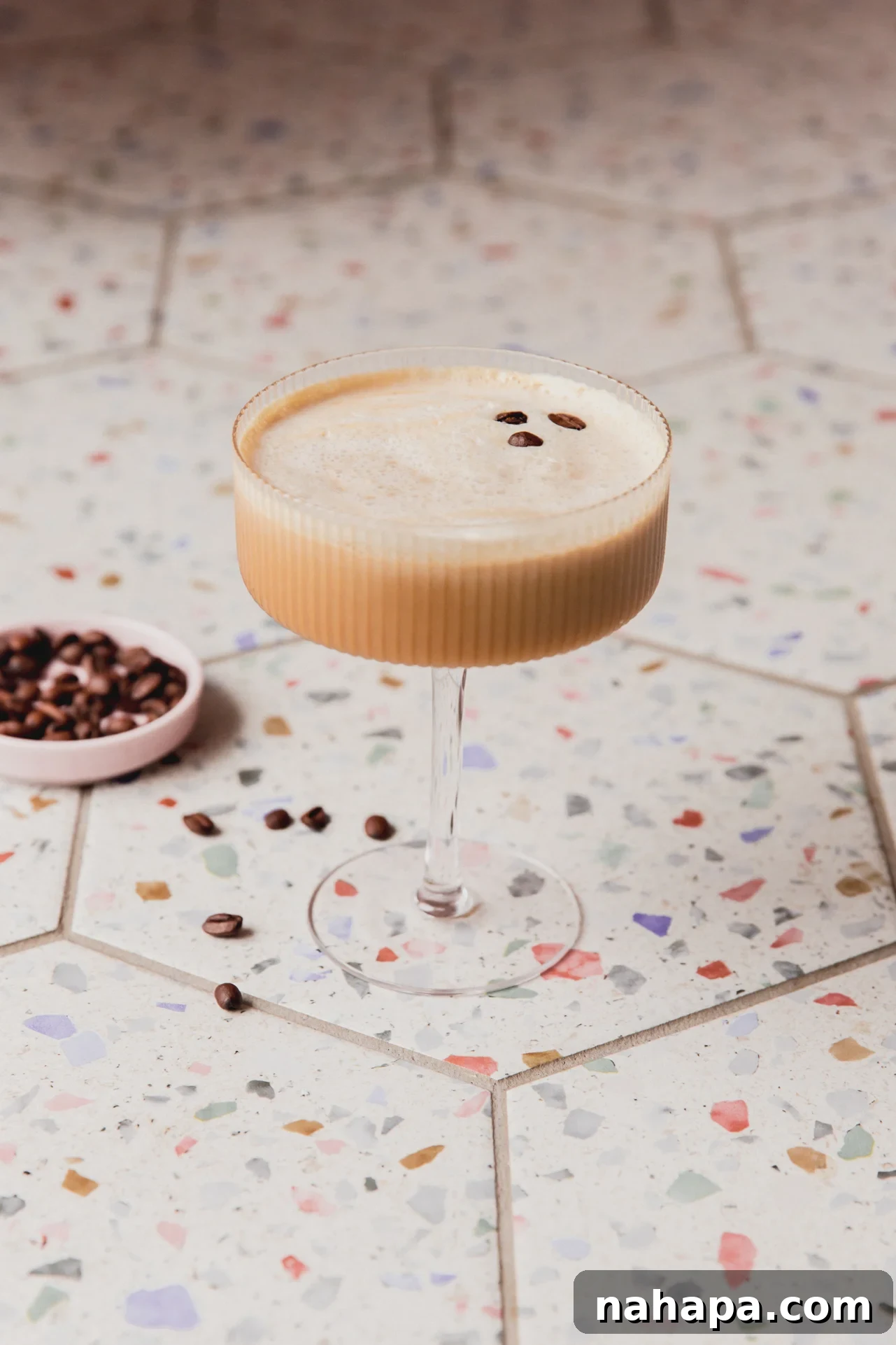Espresso martini mocktail topped off with espresso beans.