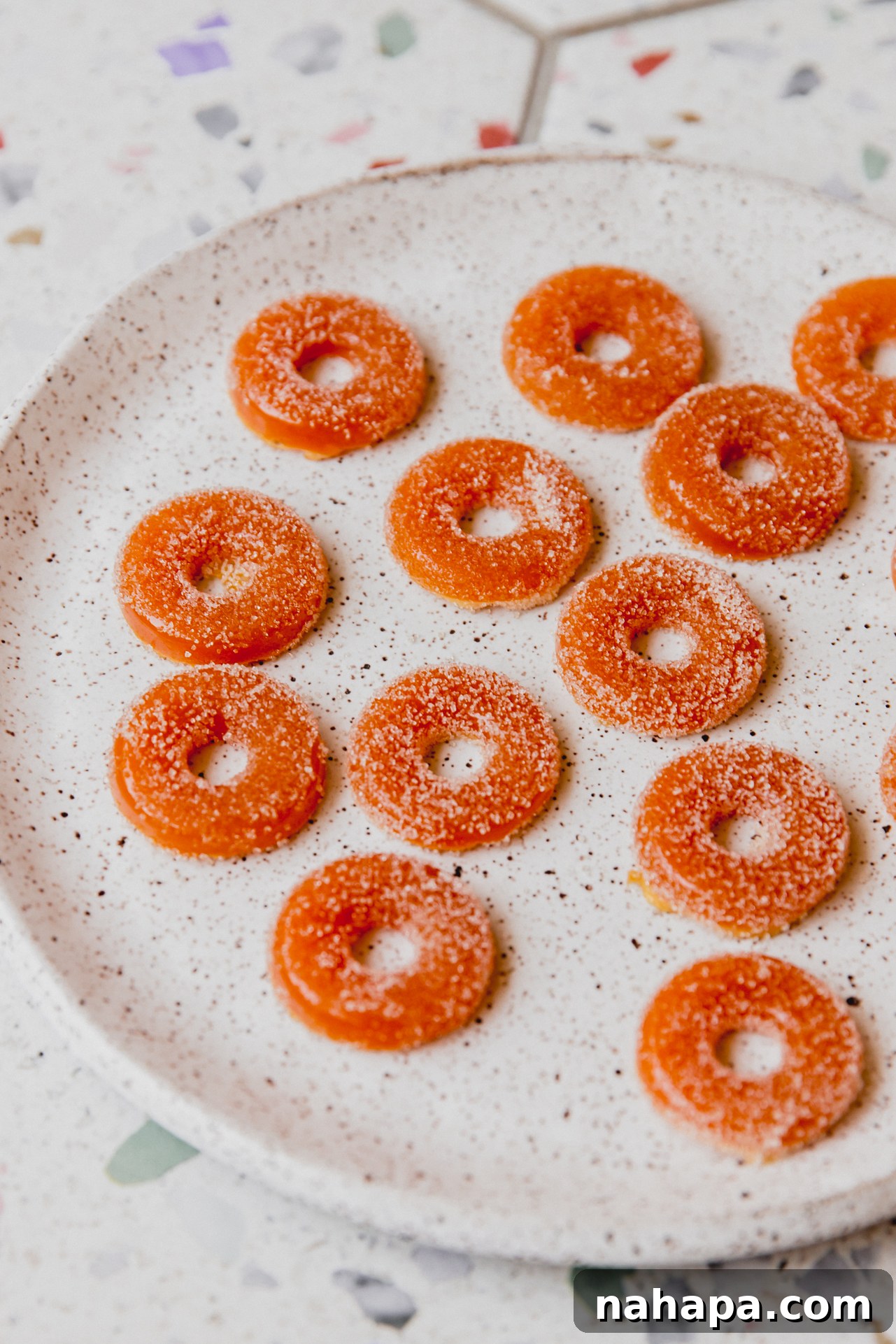 Peachy Protein Rings 10 A plate full of vibrant protein peach ring gummies, perfectly set and ready to eat.