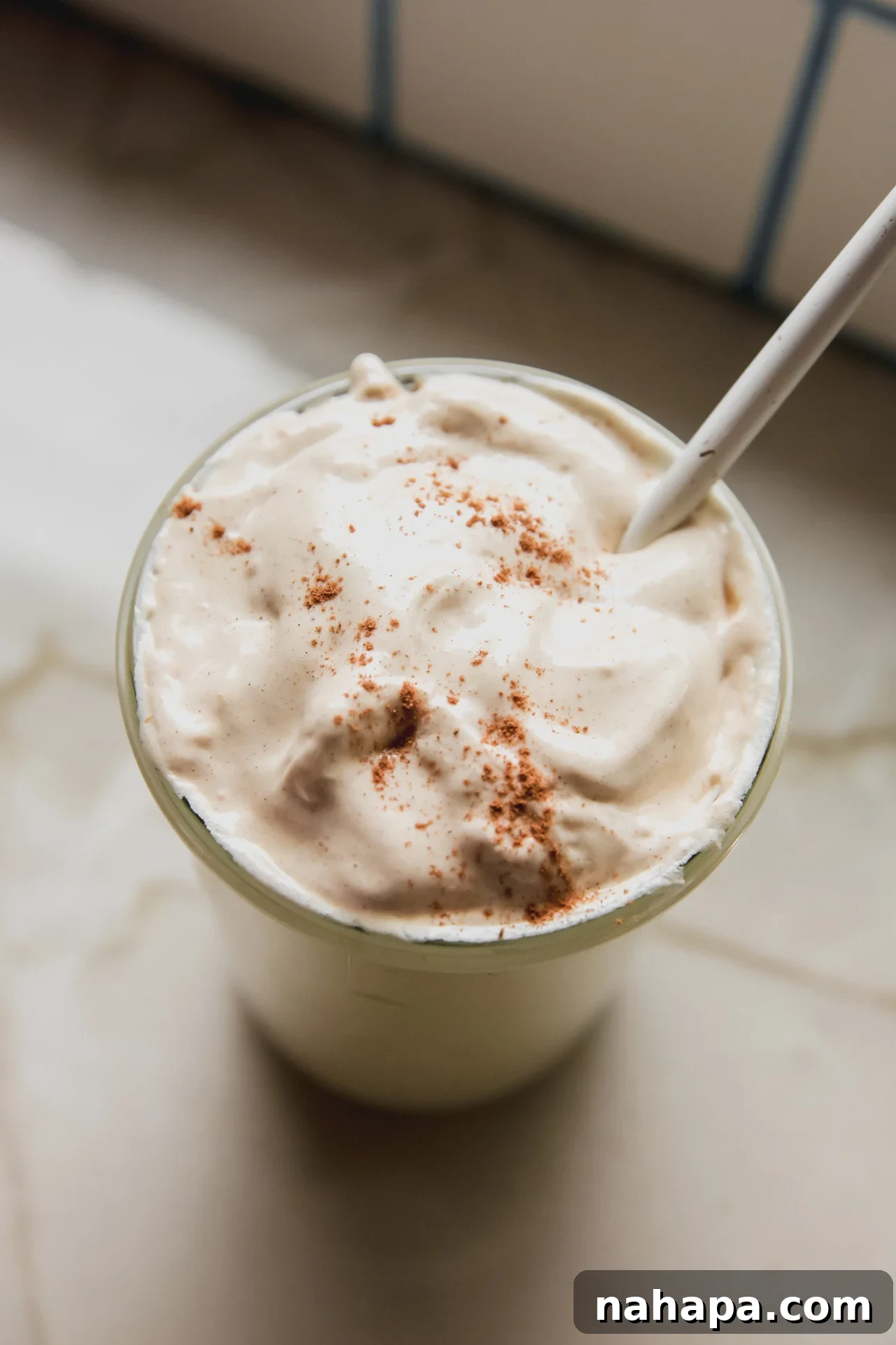 Pumpkin Spice Marshmallow Cloud 8 Pumpkin spice marshmallow fluff in a large glass jar topped with cinnamon.
