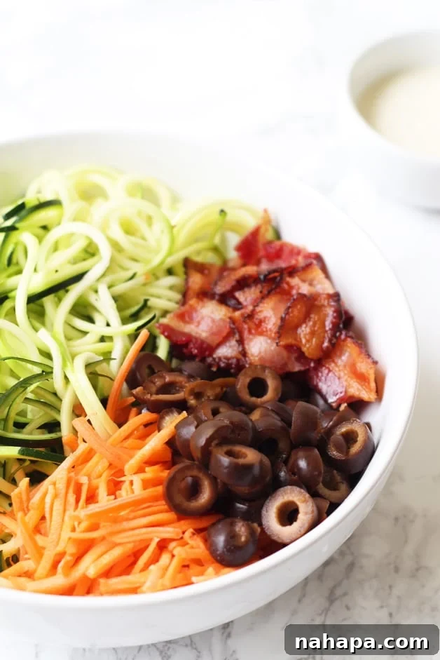 Paleo AIP Whole30 Bacon Ranch Zucchini Noodle Pasta Salad 2 Bacon Ranch Zucchini Noodle Pasta Salad (Paleo, AIP, Whole 30) - a vibrant bowl of zucchini noodles, bacon, carrots, and olives dressed in creamy ranch