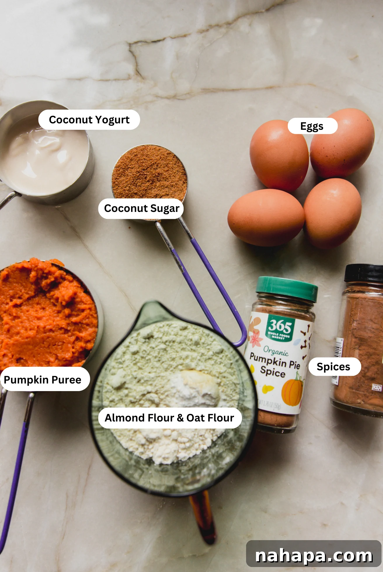 Spiced Almond Pumpkin Bread 4 All the fresh ingredients neatly arranged on a counter, ready to be combined for the almond flour pumpkin loaf.
