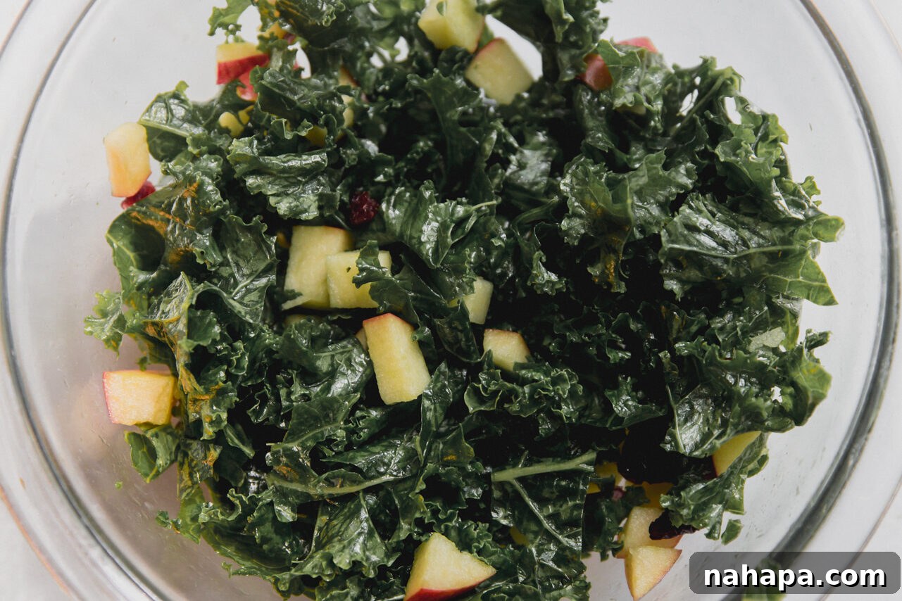 Golden Harvest Chicken & Squash Bowl 8 A vibrant kale and apple salad in a bowl, massaged with oil and lemon juice, and tossed with dried cranberries.
