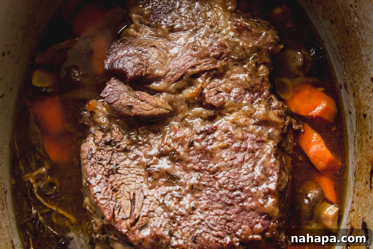 The cooked chuck roast after being removed from the oven, incredibly tender.
