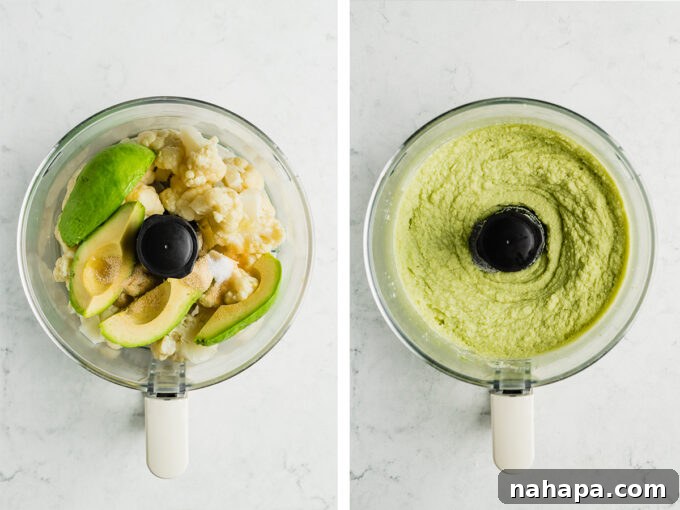 Assortment of fresh ingredients including cauliflower florets, a sliced avocado, lemon halves, and olive oil, laid out in a food processor, ready for blending.