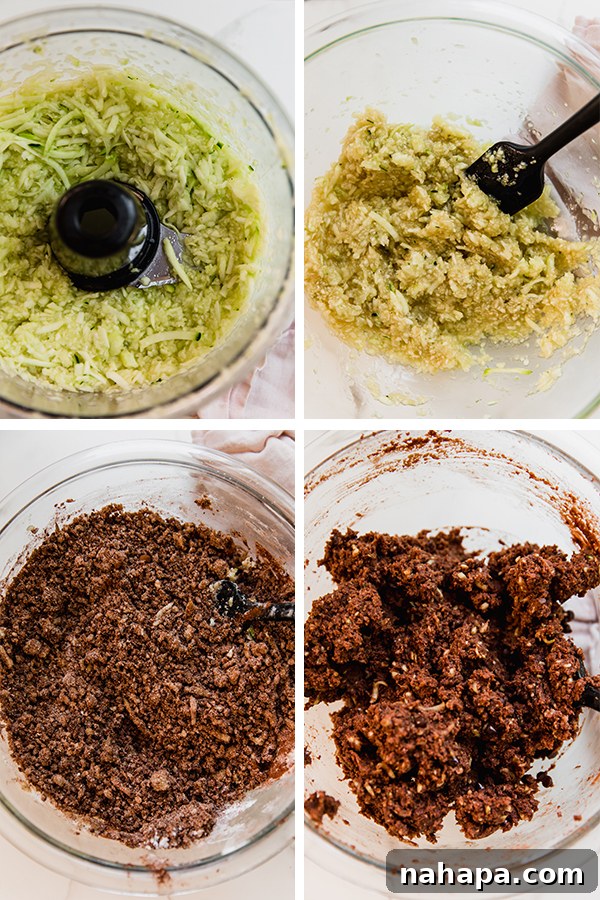 Shredded zucchini mixed with wet ingredients in a bowl.