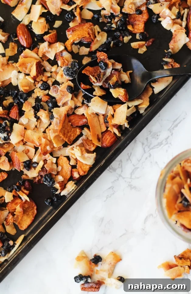 A sheet pan with homemade granola on it after baking.
