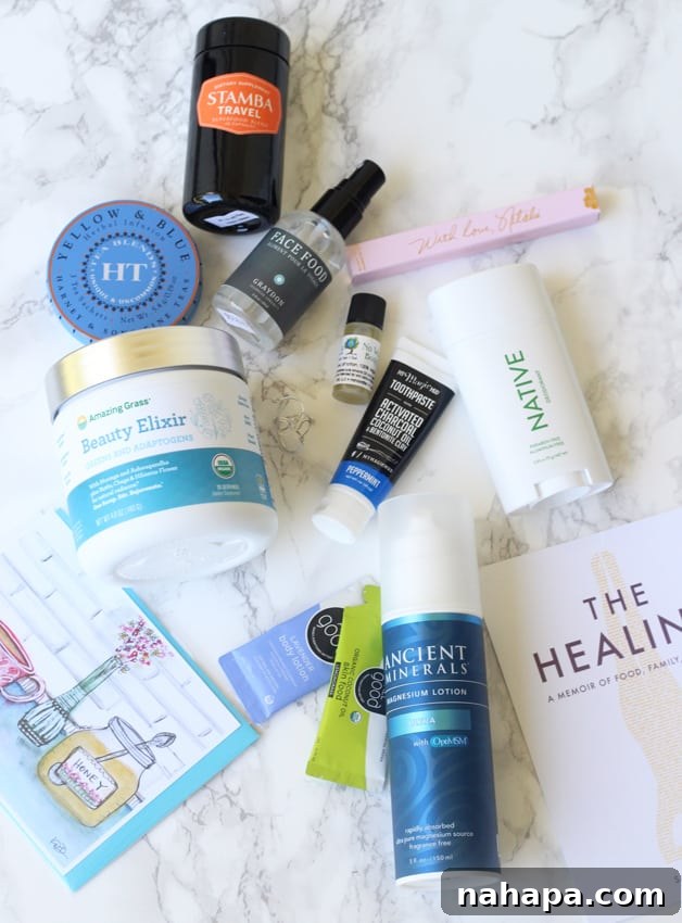 YBC Mantra Box Summer 2017 Unveiled Natural Paleo and Yoga Essentials 2 A curated collection of personal care products, wellness supplements, and lifestyle items from the YBC Mantra Box Summer 2017, neatly arranged on a countertop, showcasing the variety and quality of the contents.