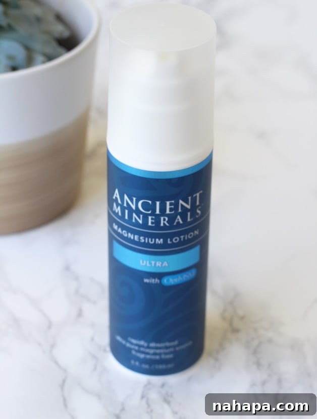 YBC Mantra Box Summer 2017 Unveiled Natural Paleo and Yoga Essentials 5 A robust bottle of Ancient Minerals Magnesium Lotion from Enviormedica standing confidently on a clean, minimalist countertop, highlighting its packaging and readiness for use.