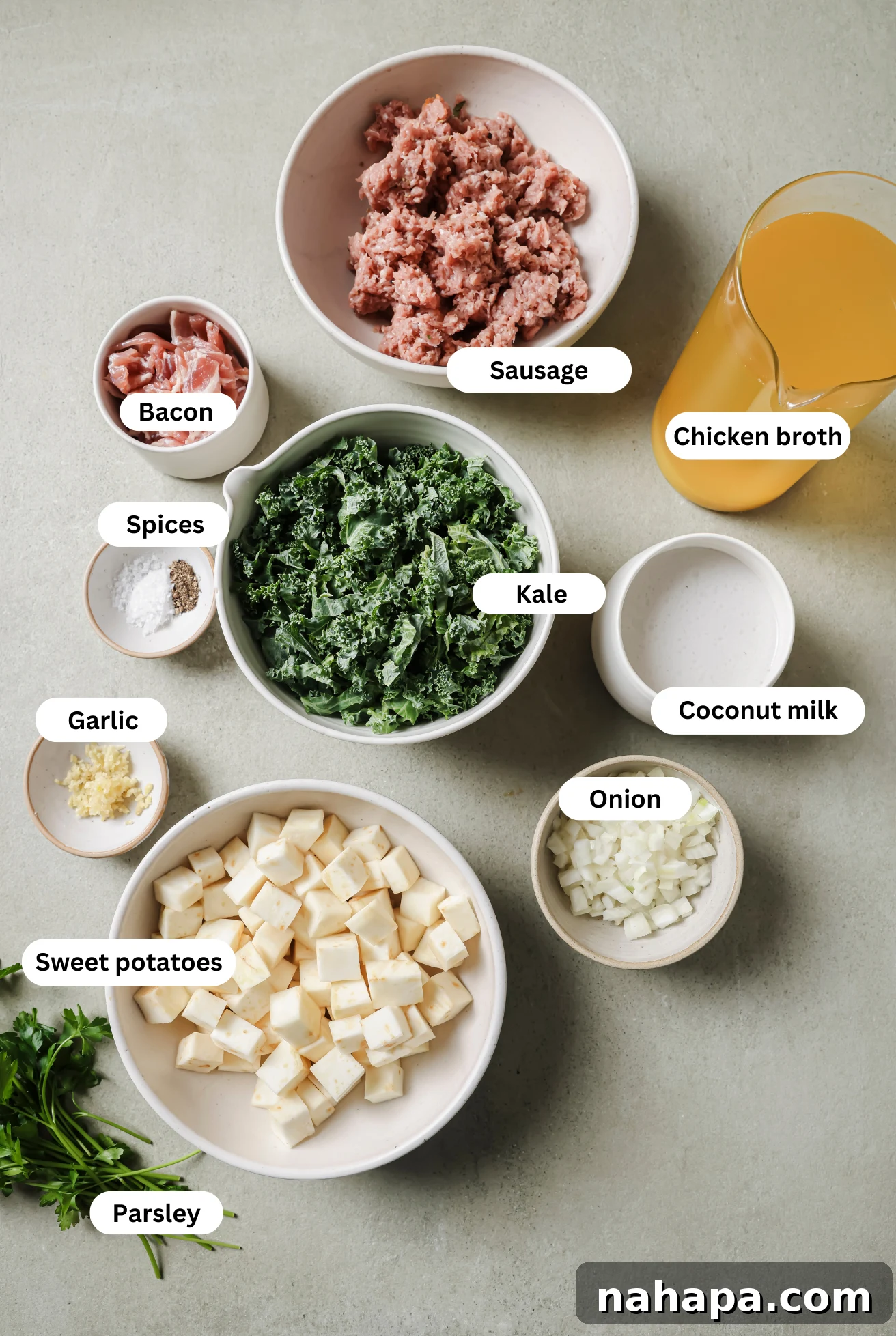 All the ingredients for Zuppa Toscana before cooking, neatly arranged on a counter.