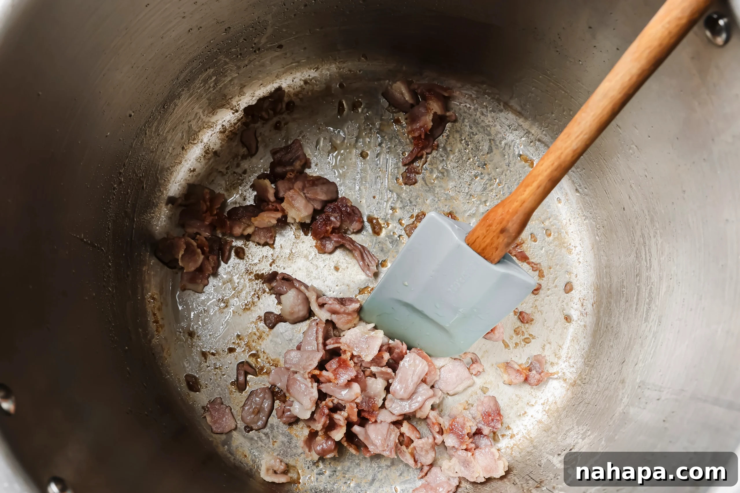 Chopped bacon sautéing in the Instant Pot liner until crispy.