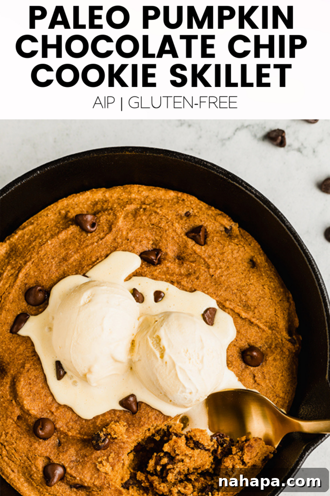 A visually appealing flat lay of fall elements and a slice of pumpkin cookie skillet, enticing readers to try the recipe.