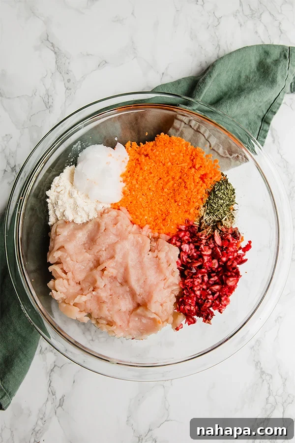 Raw turkey popper mixture with sweet potato and cranberries ready for baking