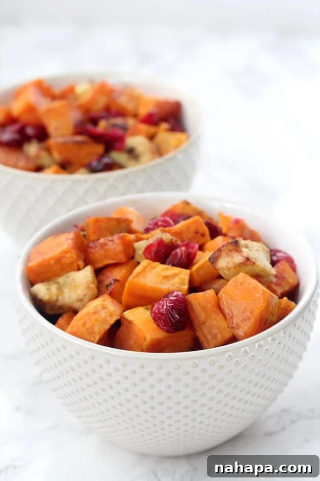 Two bowls of cinnamon cranberry sweet potato sitting out.