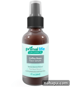 Paleo Holiday Gift Guide 8 A small amber bottle of Primal Life Organics Coffee Bean Face Serum stands on a natural surface, its minimalist label highlighting the product's organic essence. The bottle suggests a concentrated, potent formulation.
