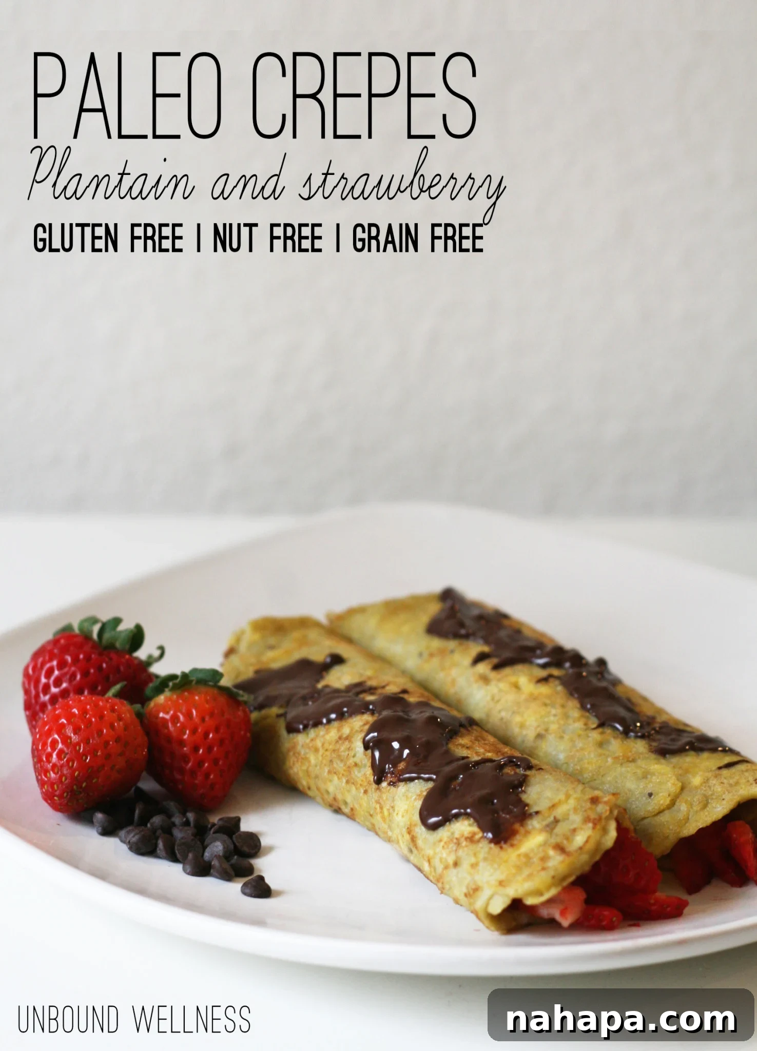 Close-up of golden paleo plantain crepes with fresh strawberries.