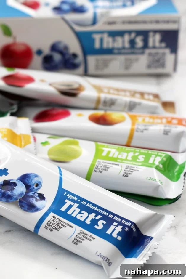 Various flavors of That's Its bars in a pile.