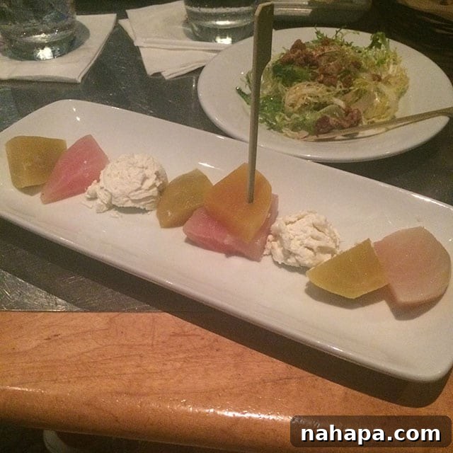 Thriving at Disney World: AIP Paleo Food Allergy Adventures 12 A beautifully plated appetizer of heirloom beets and goat cheese, with garnishes on the side, at Coral Reef Restaurant.