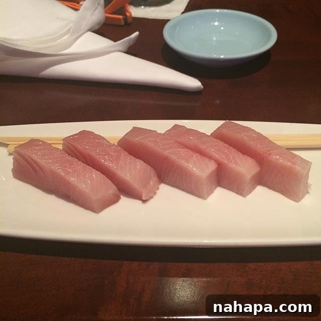 Thriving at Disney World: AIP Paleo Food Allergy Adventures 5 Plate of fresh sashimi served at Tokyo Dining in Epcot, specifically yellowtail, showcasing a simple and allergy-friendly meal.