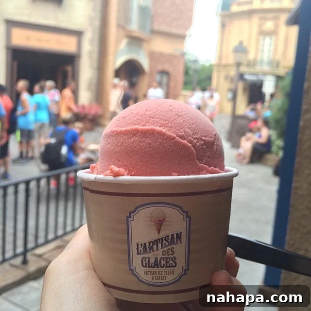 Thriving at Disney World: AIP Paleo Food Allergy Adventures 7 A vibrant scoop of strawberry sorbet in a cup, a safe and delicious dessert option for someone with allergies at Disney World.