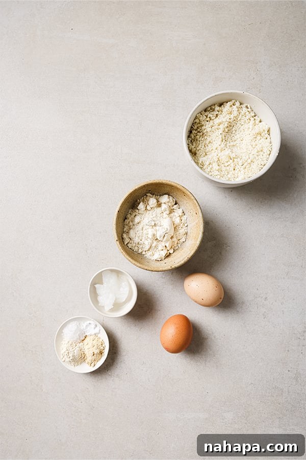 Close-up of combined cauliflower nugget mixture in a bowl, showing texture before forming.