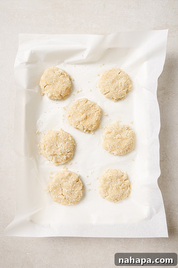 Cauliflower nuggets arranged on a baking sheet before baking.