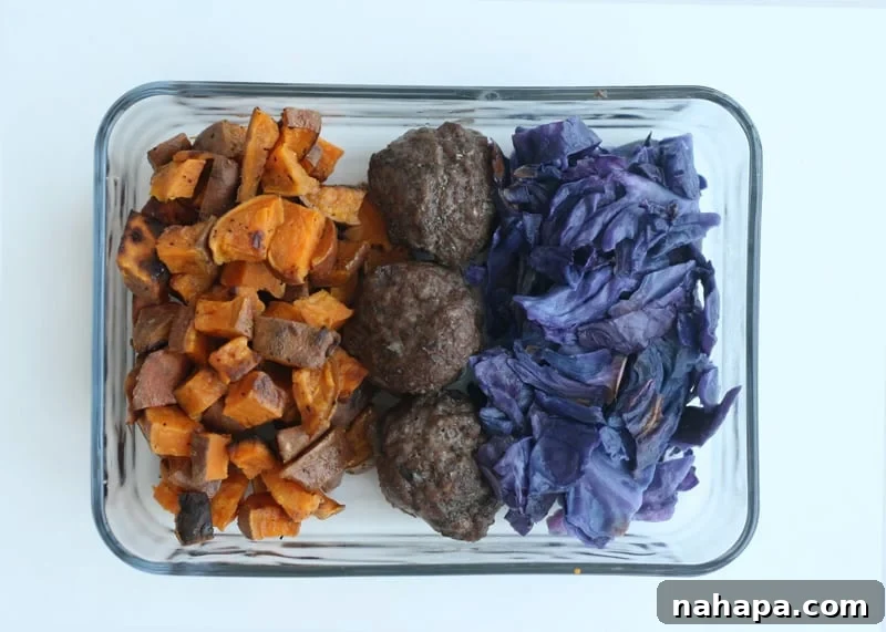 An AIP leftover lunch with grass-fed meatballs, roasted sweet potatoes, and oven-roasted cabbage