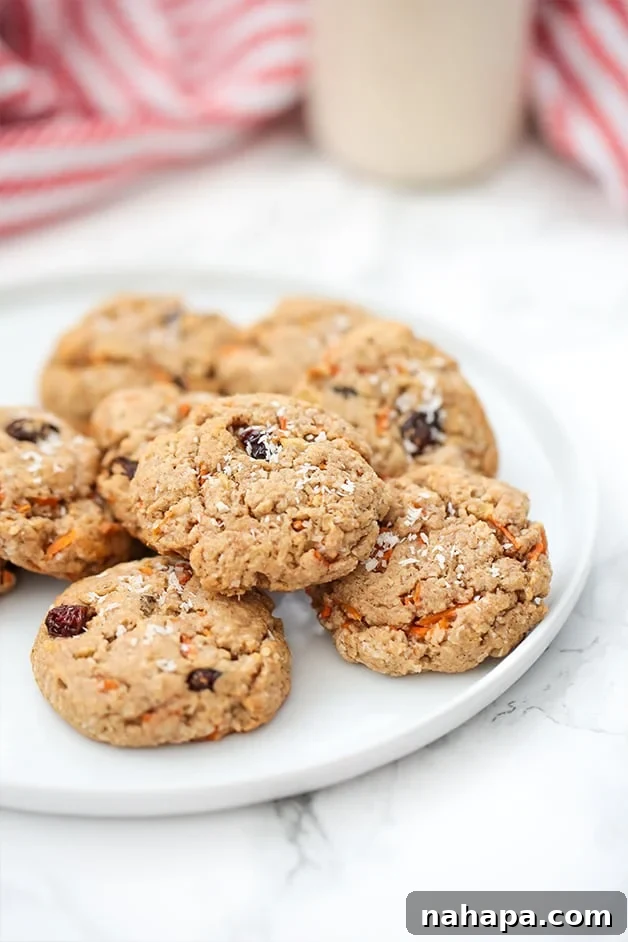 Delicious Paleo Carrot Cake Protein Cookies arranged invitingly on a baking sheet.