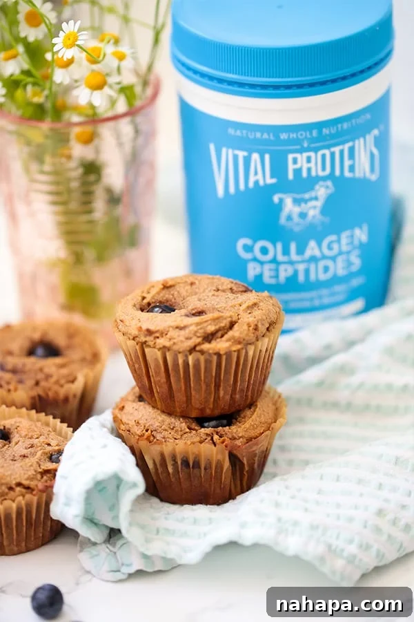 Wholesome Paleo AIP Egg-Free Blueberry Banana Muffins 2 A stack of blueberry banana muffins sitting next to Vital Protein Collagen Peptides.