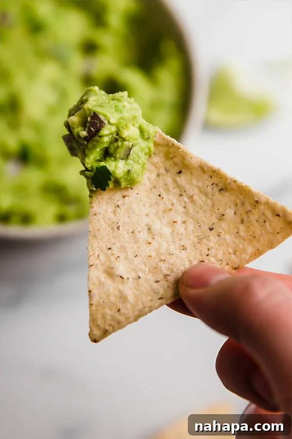 Effortless AIP Guacamole Paleo Whole30 4 Up close chip with guacamole on it