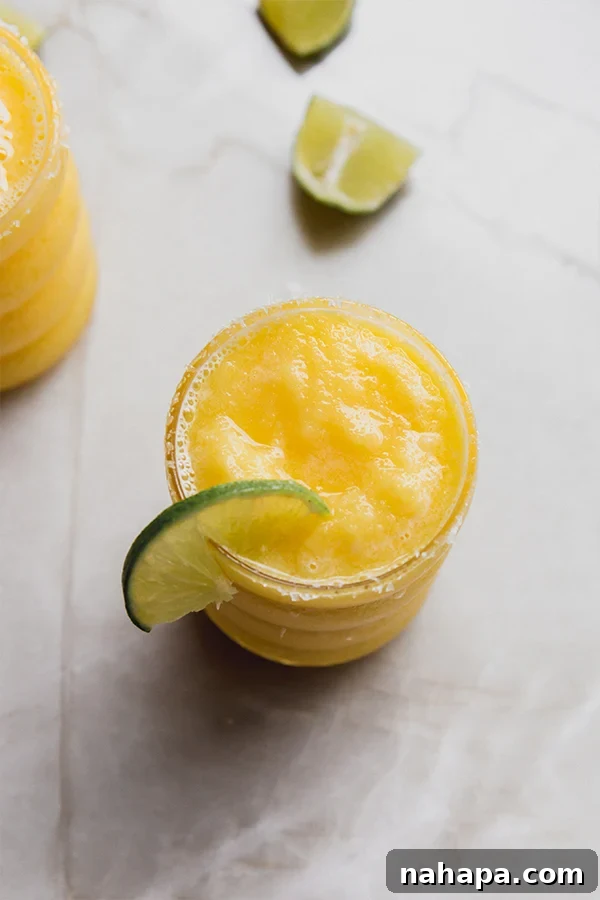 Refreshing Tropical Frozen Mango Mocktail Paleo AIP 5 Vibrant and refreshing Frozen Mango Margarita Mocktail ready to be enjoyed