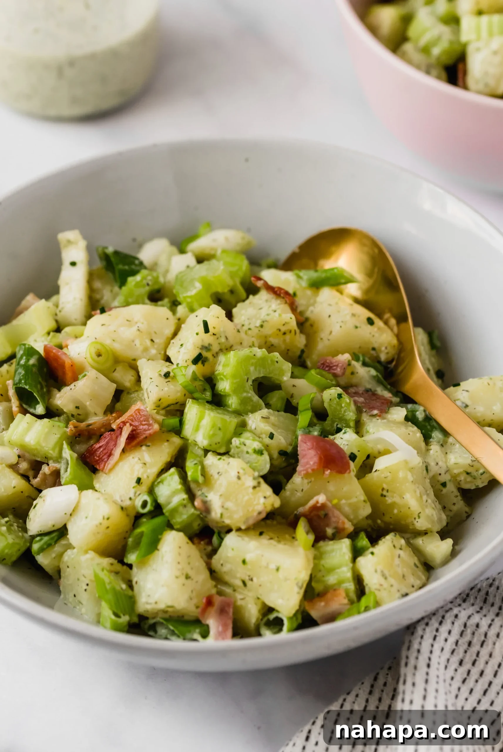 Wholesome Bacon Ranch Sweet Potato Salad 6 A vibrant bowl of Bacon Ranch Sweet Potato Salad, showcasing the creamy texture, crispy bacon bits, and fresh green onions, ready to be served as a healthy and delicious side dish.