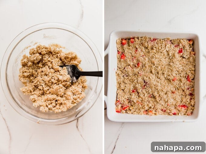 Paleo AIP Vegan Strawberry Rhubarb Crumble 5 The strawberry rhubarb filling generously covered with the golden, crumbly crisp topping, ready to be baked to perfection.