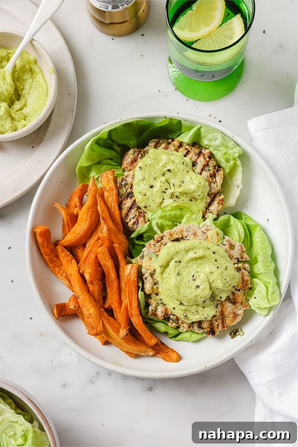 Spinach Avocado Chicken Burgers with fresh garnishes