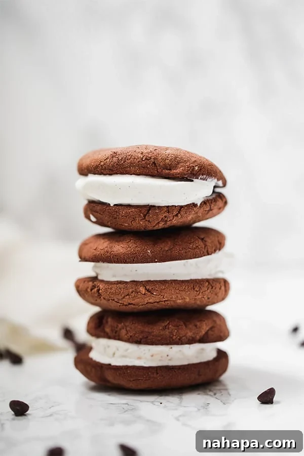 A stack of three ice cream sandwiches on top of each other.