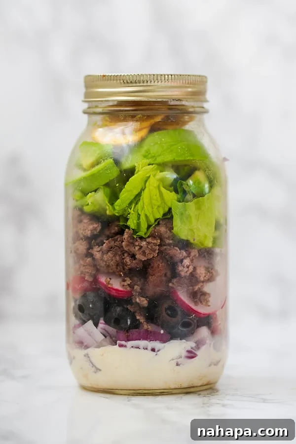 Streamline Your Diet 5 Paleo Whole30 AIP Mason Jar Salads 4 Mason jar taco salad layered with dairy-free sour cream dressing, red onion, olives, radishes, ground beef, avocado, and romaine