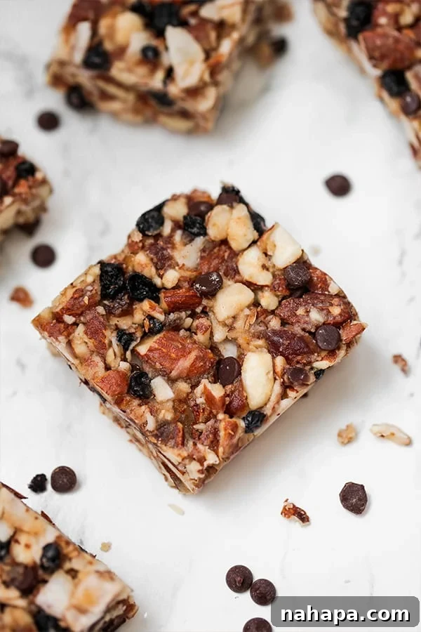 paleo granola bars arranged neatly on a wooden surface, ready to be enjoyed