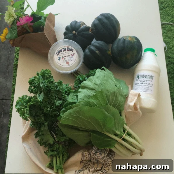 The Weekend Unfolds 4 Farmers market haul including acorn squash, leafy greens, goat milk, cheese, and fresh flowers.