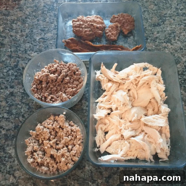 The Weekend Unfolds 9 Prepped meats for the week, including beef burgers, bacon, pork, bison, and a whole chicken.